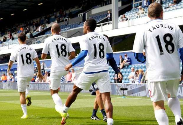 Popular: QPR players warm up wearing t-shirts in honour of their injured team-mate (Action Images / Jed Leicester)