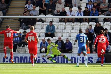 Tough spot: Jamie Jones denies Cody McDonald with his second penalty save in under a week (Photo by TGS Photo)