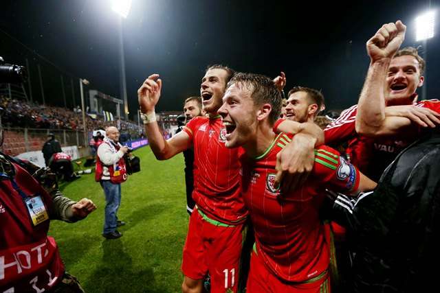 Chris Gunter celebrates with Gareth Bale as Wales enter 2016 the highest ranked British nation (Photo by Action Images via Reuters / Matthew Childs)