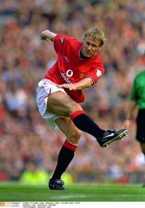 Red Devil: Sheringham won the treble with United (Photo by Action Images / John Sibley)