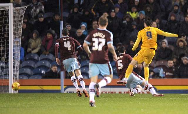 Oh, brother! Will Keane shoots through the legs of twin Michael to score for Preston (Photo by Action Images / Paul Burrows)