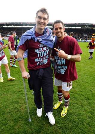 Vings: Sam Vokes and Danny Ings celebrate promotion to the Premier League on the Turf Moor pitch (Photo by Action Images / Paul Currie