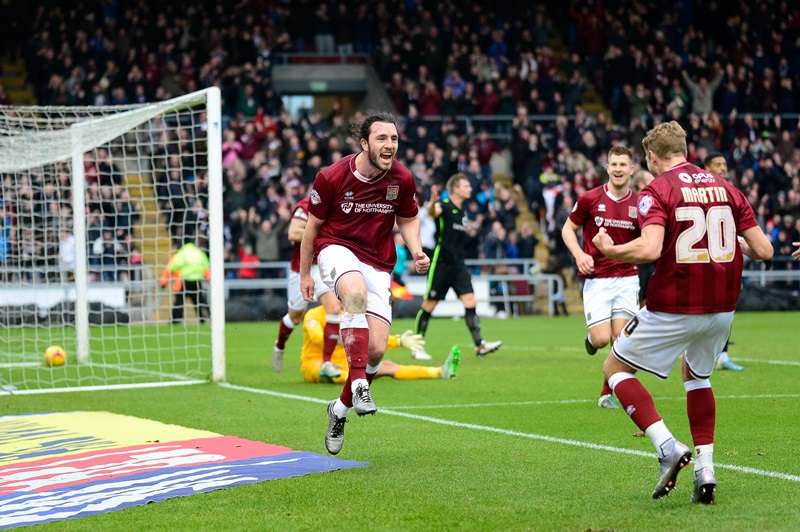 Leading the way: Northampton midfielder John-Joe O'Toole celebrates a goal for the league leaders (photo by PSI Photography)