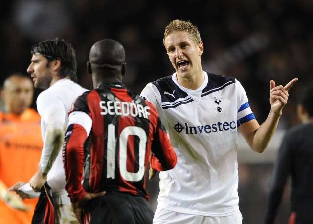 Football - Tottenham Hotspur v AC Milan UEFA Champions League Second Round Second Leg - White Hart Lane, London, England - 10/11 - 9/3/11 AC Milan's Clarence Seedorf (L) and Tottenham's Michael Dawson at full time Mandatory Credit: Action Images / Tony O'Brien Livepic