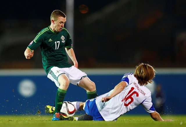 Football - Northern Ireland v Faroe Islands - UEFA Euro 2016 Qualifying Group F - Windsor Park, Belfast, Northern Ireland - 11/10/14 Northern Ireland's Shane Ferguson (L) in action with Faroe's Joan Edmundsson  Mandatory Credit: Action Images / Jason Cairnduff Livepic EDITORIAL USE ONLY.