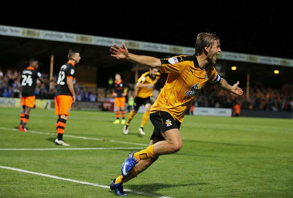 Cambridge United's Luke Berry celebrates scoring their winning goal 