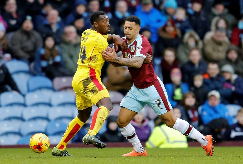 Eager: Lloyd Doyley, seen here jostling with Andre Gray while at Rotherham, is keen to impress after joining Colchester a week ago (Picture: Action Images)