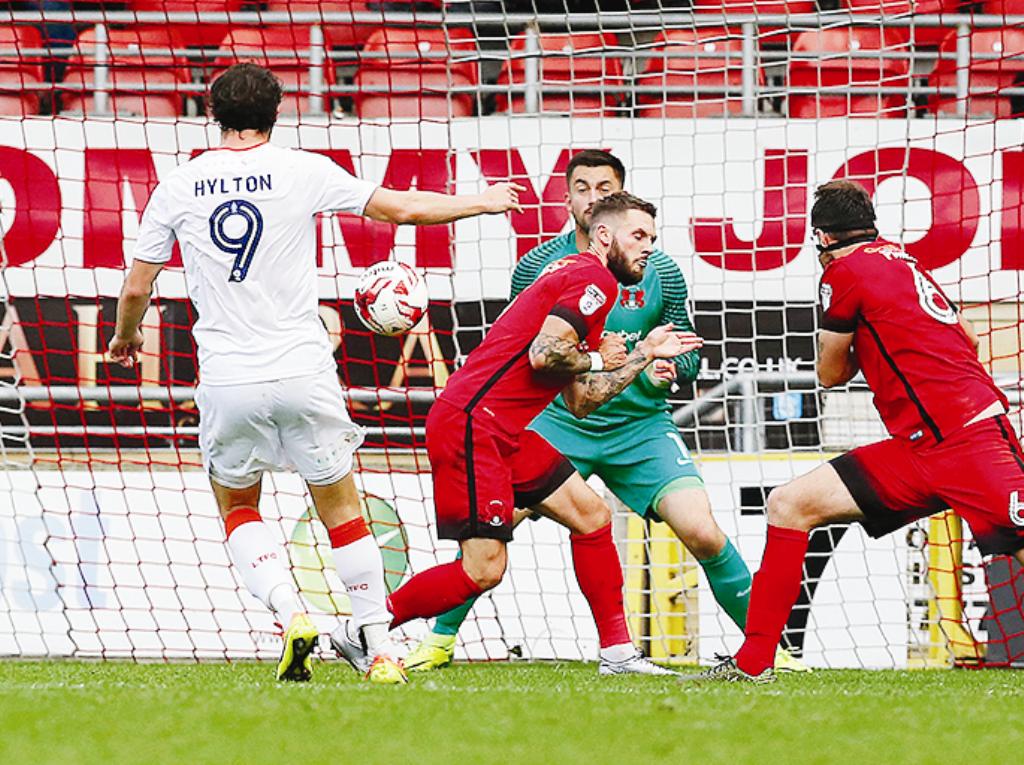 On the spot: Hylton scores from the spot against Leyton Orient (Picture: Action Images)