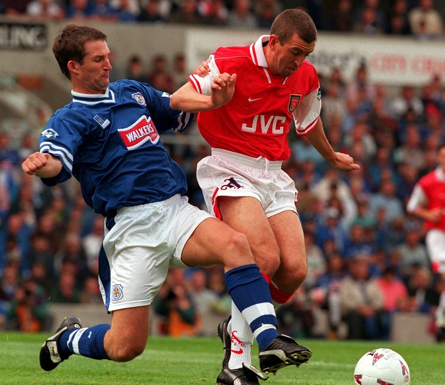 Fox on a run: Grayson, in his Leicester days, tackles Nigel Winterburn (photo by Action Images)