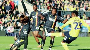 RIGHT ON TIME: Oxford United’s Siriki Dembele fires in their late winner PICTURES: Steve Edmunds