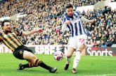 ON THE STRETCH: Hull’s Lewie Coyle attempts to block the cross of West Brom’s Mikey Johnston PICTURES: Alamy