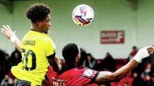 IT’S MINE: Harrogate Town defender Bryant Bilongo, left, gets up to win a header PICTURES: PSI/Manjit Narotra