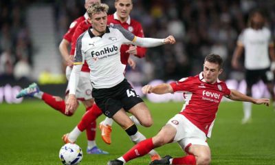 COMMITTED: Bristol City’s Adam Randell slides in to tackle Derby’s Bobby Clark PICTURE: Alamy