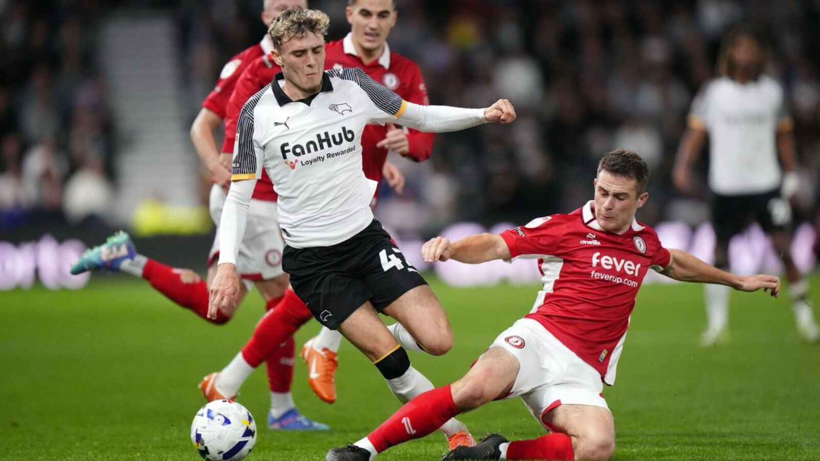 COMMITTED: Bristol City’s Adam Randell slides in to tackle Derby’s Bobby Clark PICTURE: Alamy