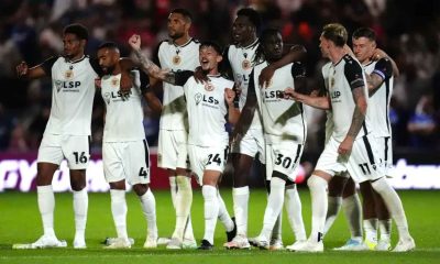 Bromley celebrate their penalty shootout win (John Walton/PA).