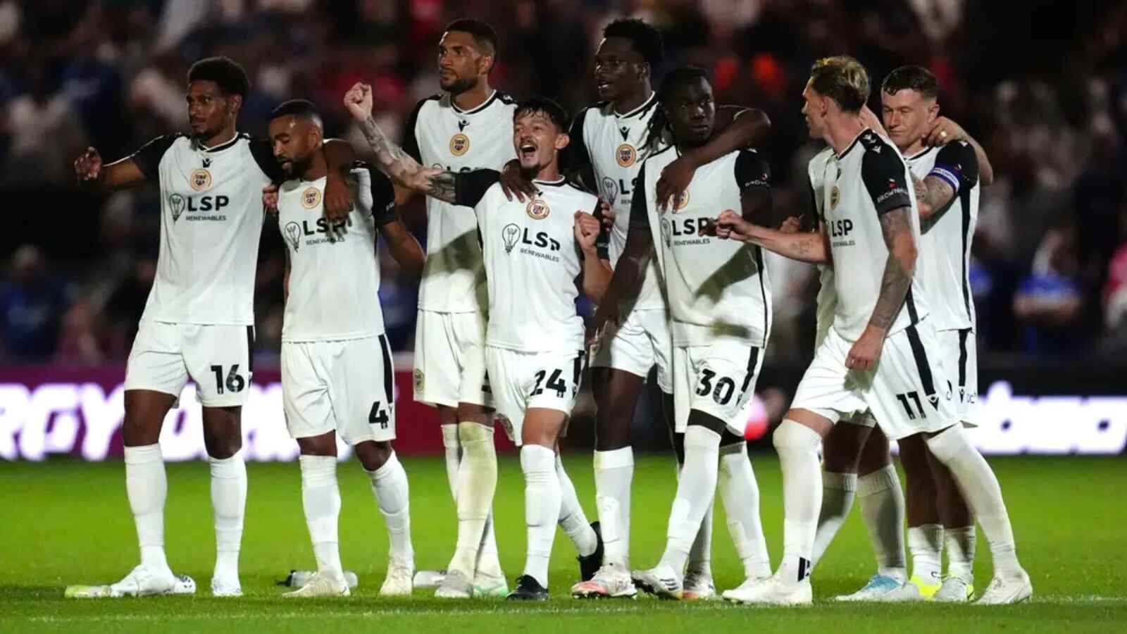 Bromley celebrate their penalty shootout win (John Walton/PA).