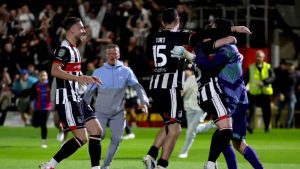 Grimsby goalkeeper Christy Pym (right) is congratulated by his team-mates (Nigel French/PA)