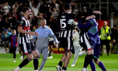 Grimsby goalkeeper Christy Pym (right) is congratulated by his team-mates (Nigel French/PA)