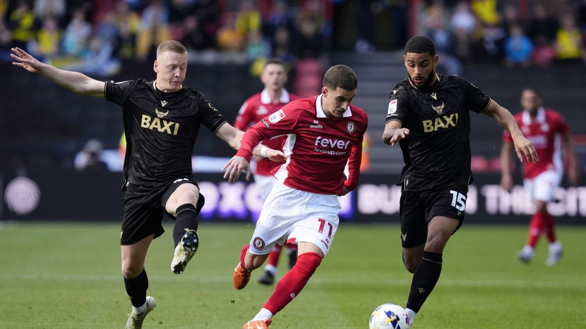 Bristol City’s Anis Mehmeti battles for the ball with Oxford's Brian De Keersmaecker and Brodie Spencer