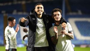 Grimsby's Jaze Kabia, left, and George McEachran celebrate success at Sheffield Wednesday