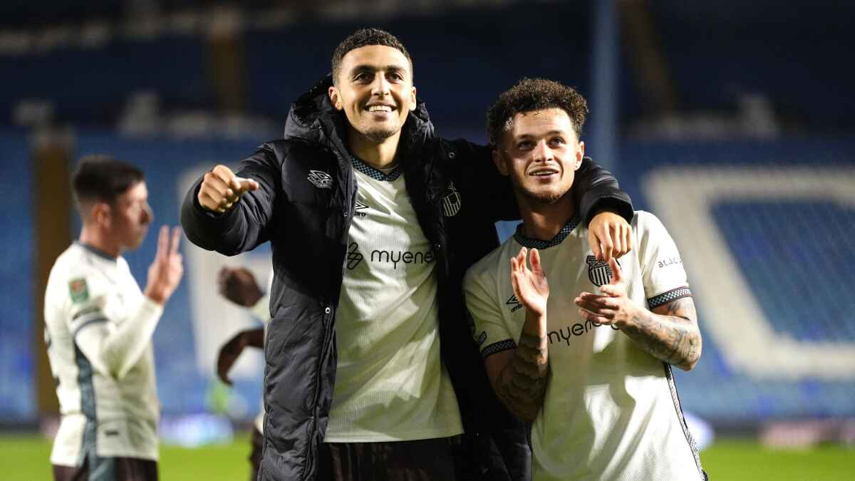 Grimsby's Jaze Kabia, left, and George McEachran celebrate success at Sheffield Wednesday