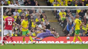 Vladan Kovacevic dives in vain to stop Ryan Longman scoring Wrexham’s second goal