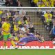 Vladan Kovacevic dives in vain to stop Ryan Longman scoring Wrexham’s second goal