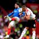 Portsmouth’s Conor Chaplin (left) battle for possession of the ball in the air with Southampton’s Taylor Harwood-Bellis