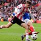 Southampton’s Tom Fellows battles for the ball against Portsmouth