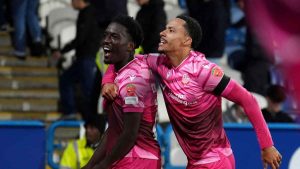 Amario Cozier-Duberry celebrates his last-gasp winner with team-mate Josh Dacres-Cogley