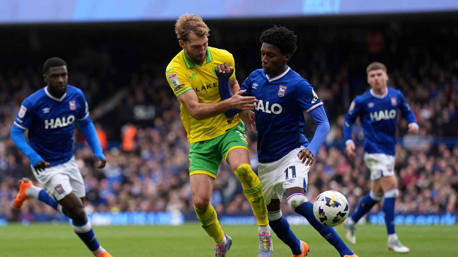 Norwich City’s Jack Stacey (left) and Ipswich Town’s Jaden Philogene battle for the ball