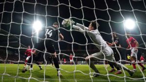 Oxford goalkeeper Jamie Cumming fails to stop Wrexham’s Nathan Broadhead (left) from scoring