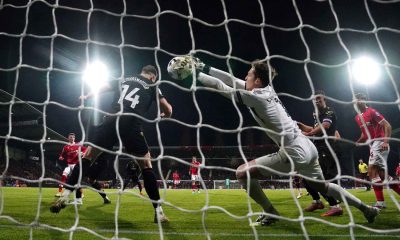 Oxford goalkeeper Jamie Cumming fails to stop Wrexham’s Nathan Broadhead (left) from scoring