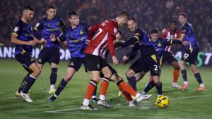 Lincoln City’s Ben House takes the shot that led to their winner