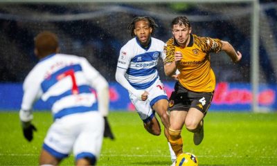 Hull City’s Charlie Hughes, right, attempts to break away from QPR match-winner Rumarn Burrell