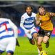 Hull City’s Charlie Hughes, right, attempts to break away from QPR match-winner Rumarn Burrell