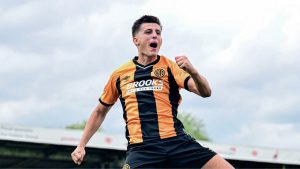 Kell Watts celebrates scoring for Cambridge United