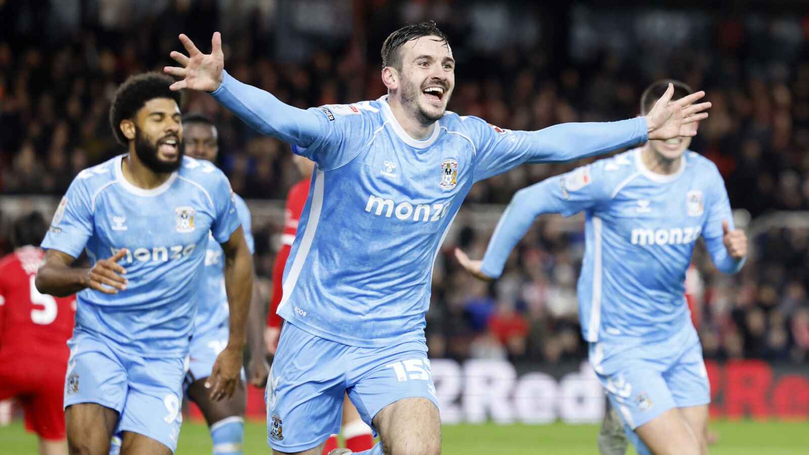 Coventry City's Liam Kitching (centre) celebrates