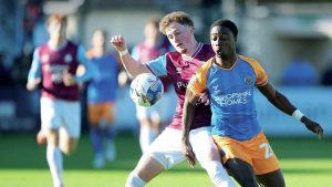 Shrewsbury Town’s Ismeal Kabia, right, battles for the ball in the FA Cup win at South Shields
