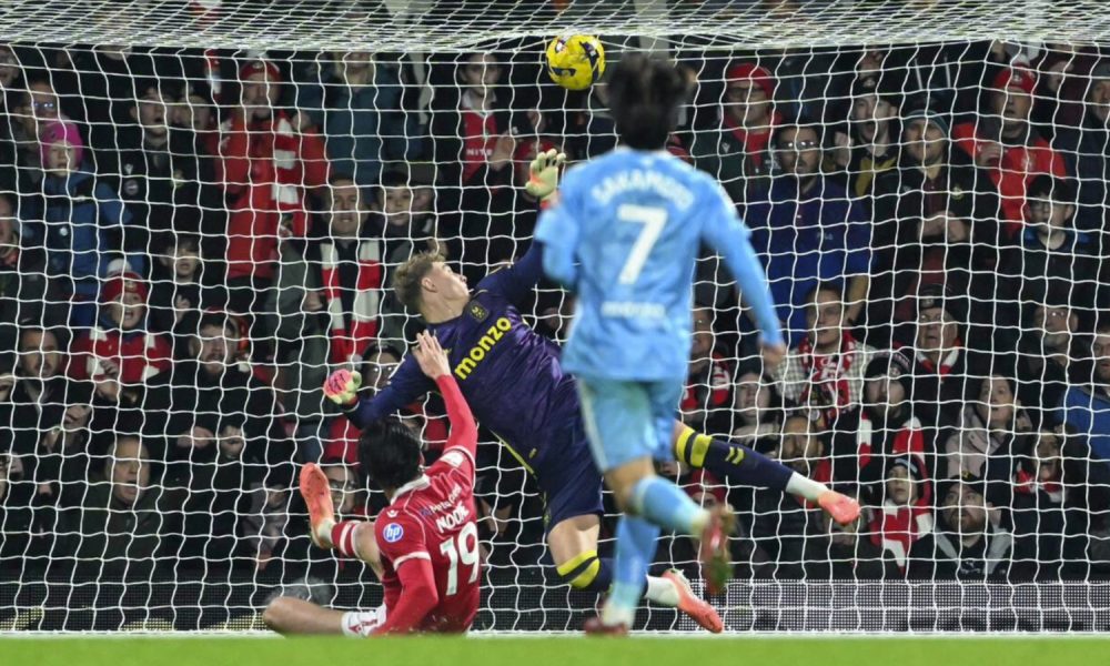 Kieffer Moore slides in to score his first goal for Wrexham
