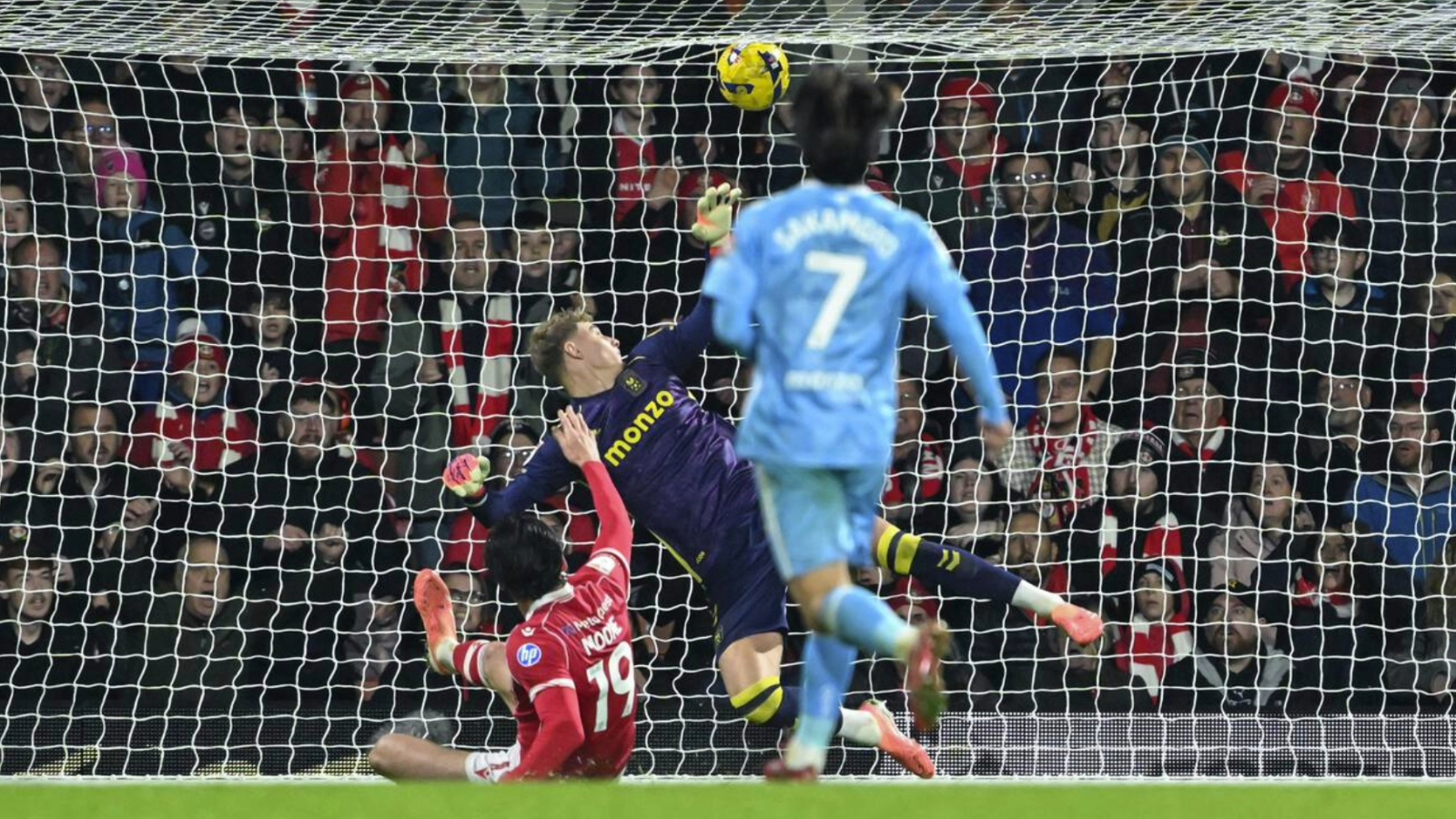 Kieffer Moore slides in to score his first goal for Wrexham