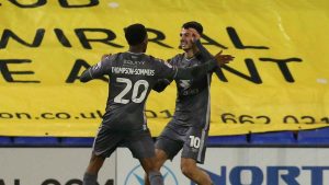 Aaron Collins, right, has set his sights high at MK Dons