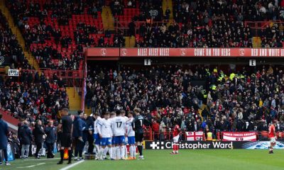Players and officials wait