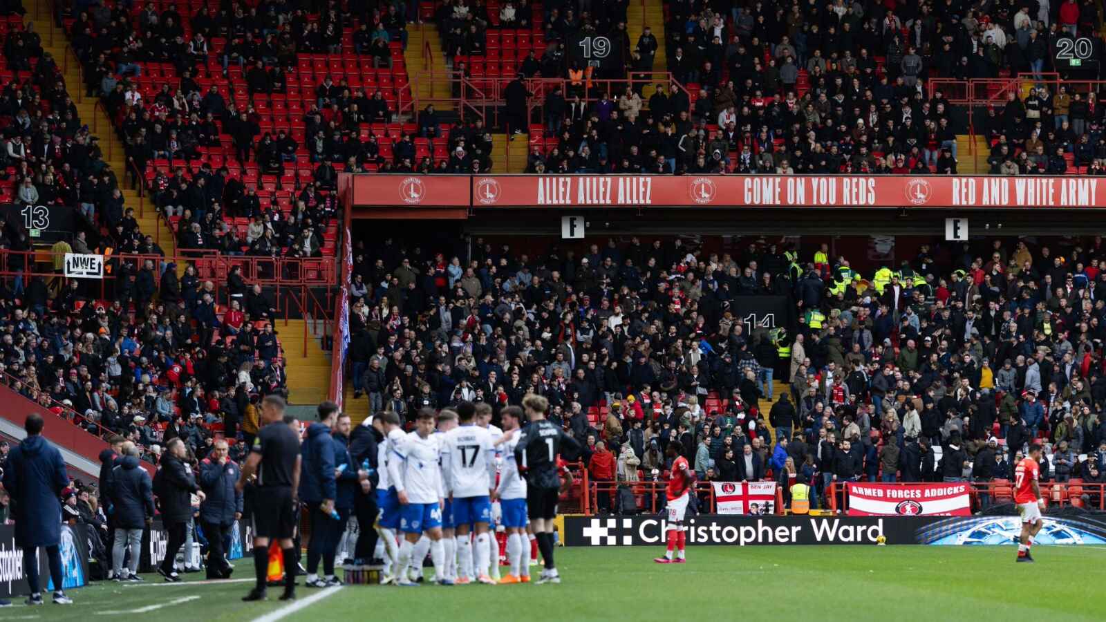 Players and officials wait