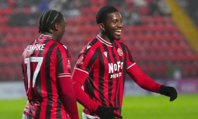 Walsall’s Daniel Kanu (right) celebrates scoring from the penalty spot
