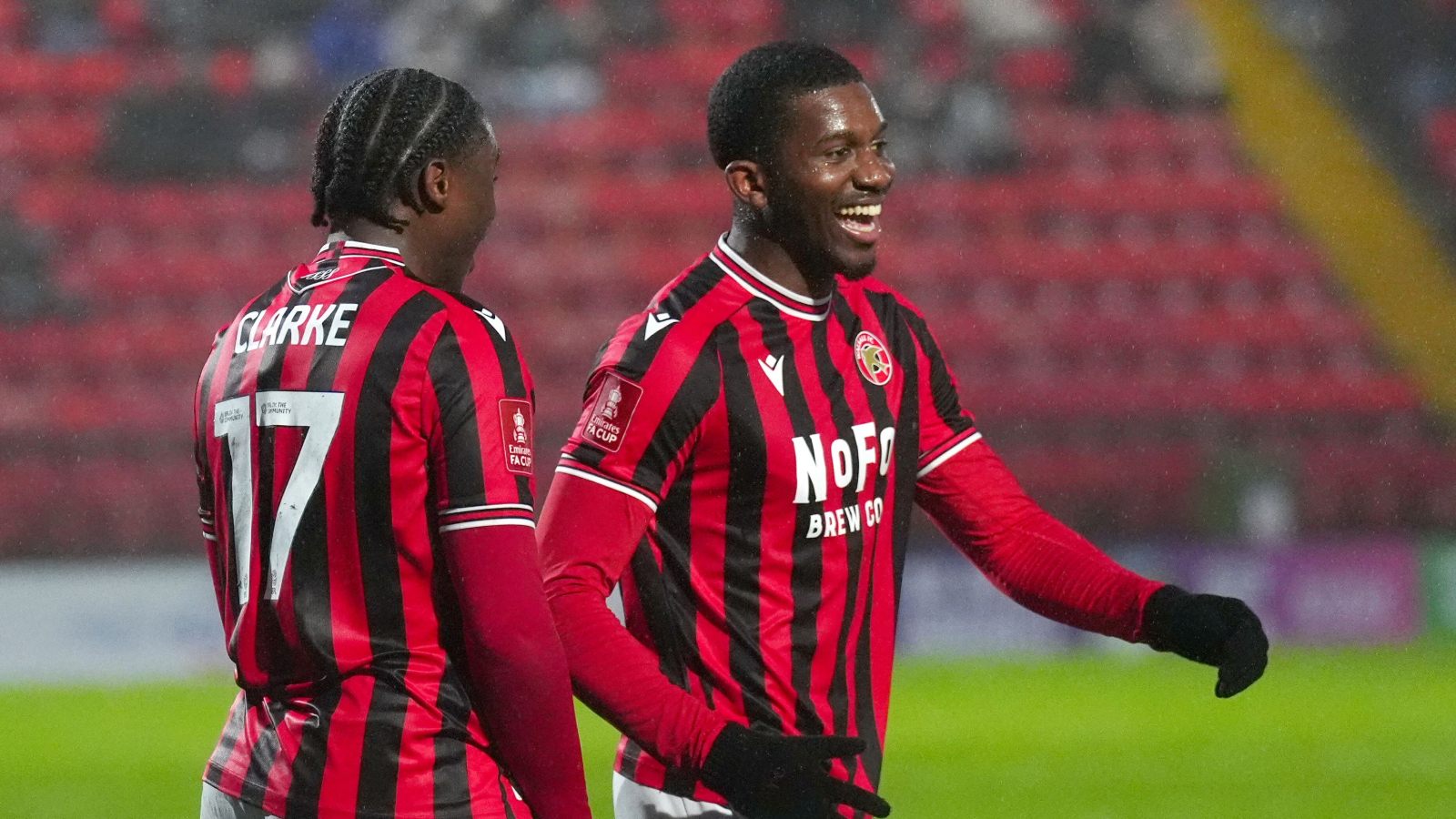 Walsall’s Daniel Kanu (right) celebrates scoring from the penalty spot