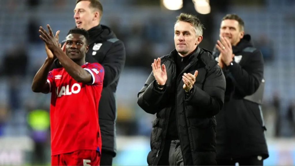 Ipswich Town manager Kieran McKenna applauds the fans