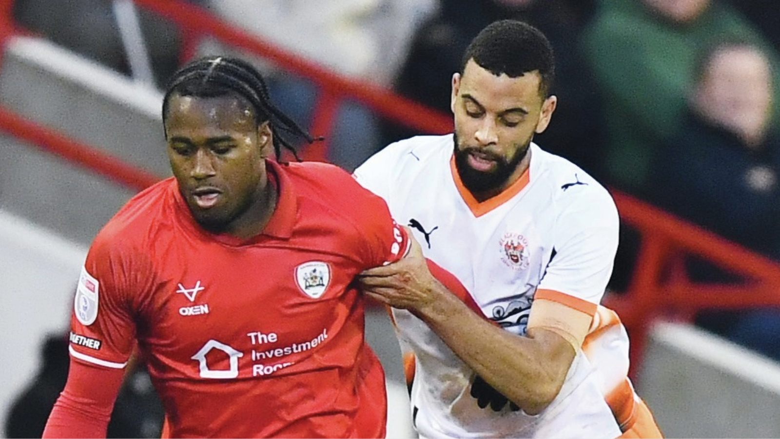 Barnsley’s Reyes Cleary is tracked by Blackpool’s CJ Hamilton