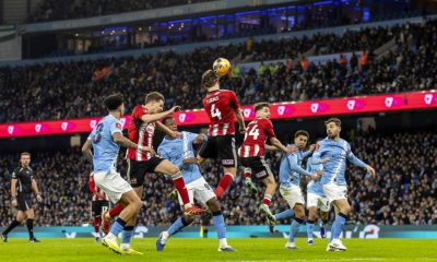 Exeter City’s Ed Turns heads the ball away