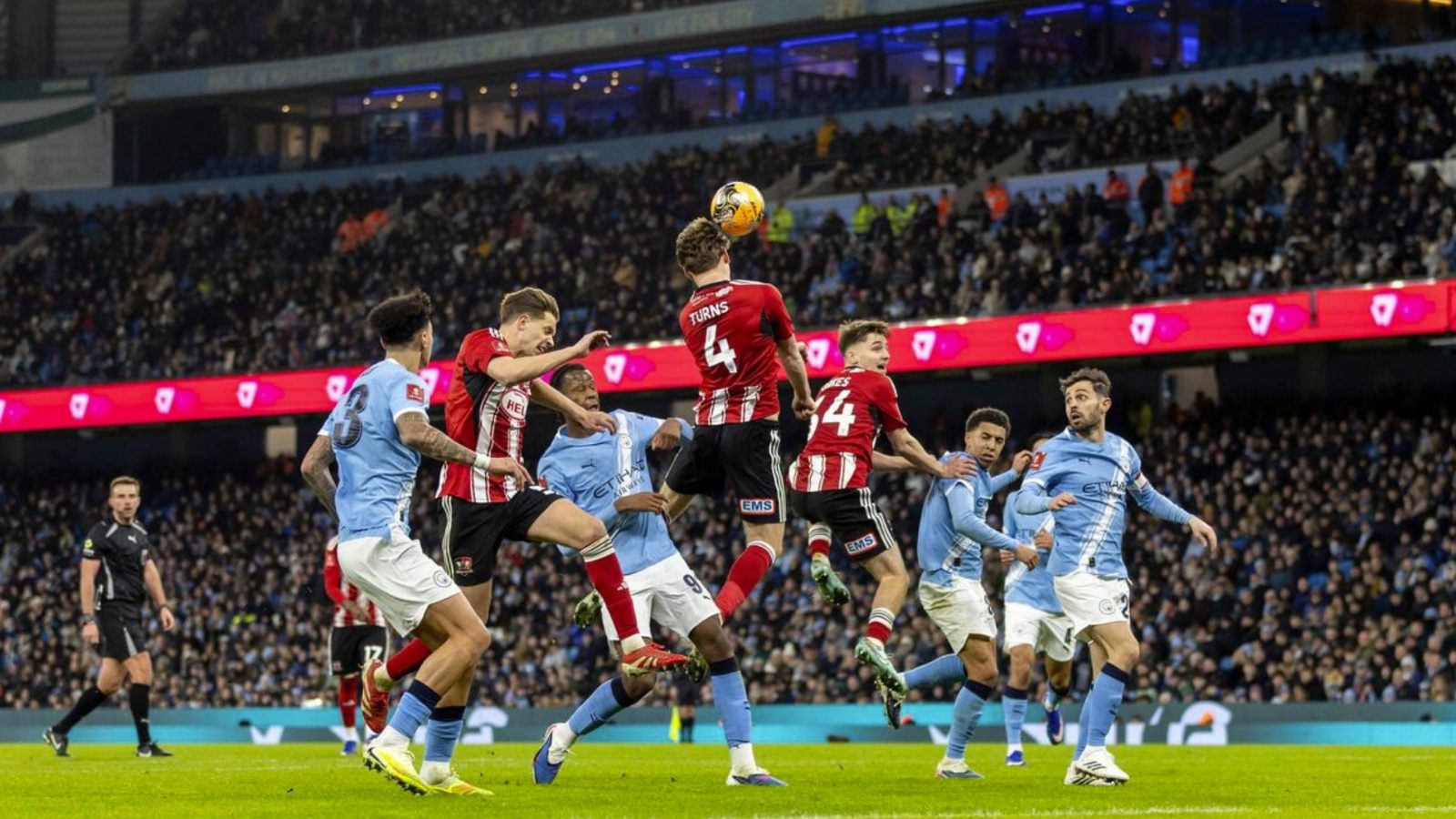 Exeter City’s Ed Turns heads the ball away